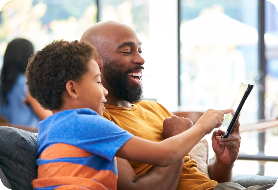 Family reviewing their Spectrum services on a device